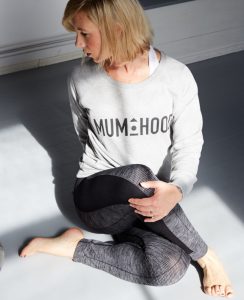 Pip wearing the Frame Mumhood sweatshirt.